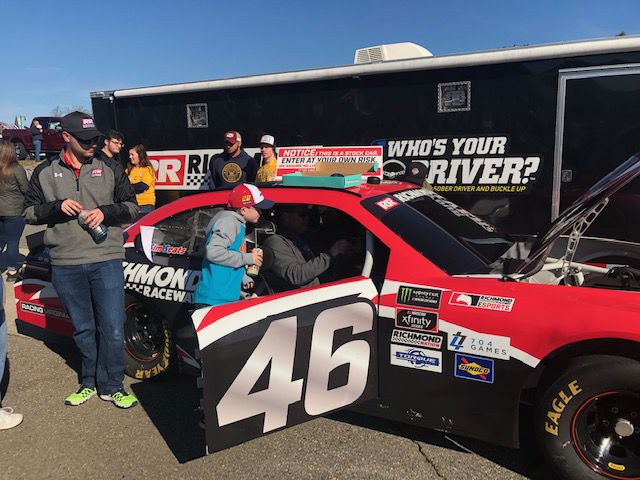 STP 500_fans check out cars.jpg